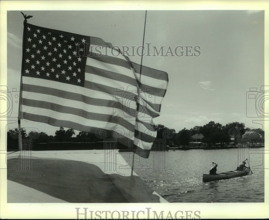 1992 Press Photo American Flag flies over irogue/Canoe Races in Madisonville - Historic Images