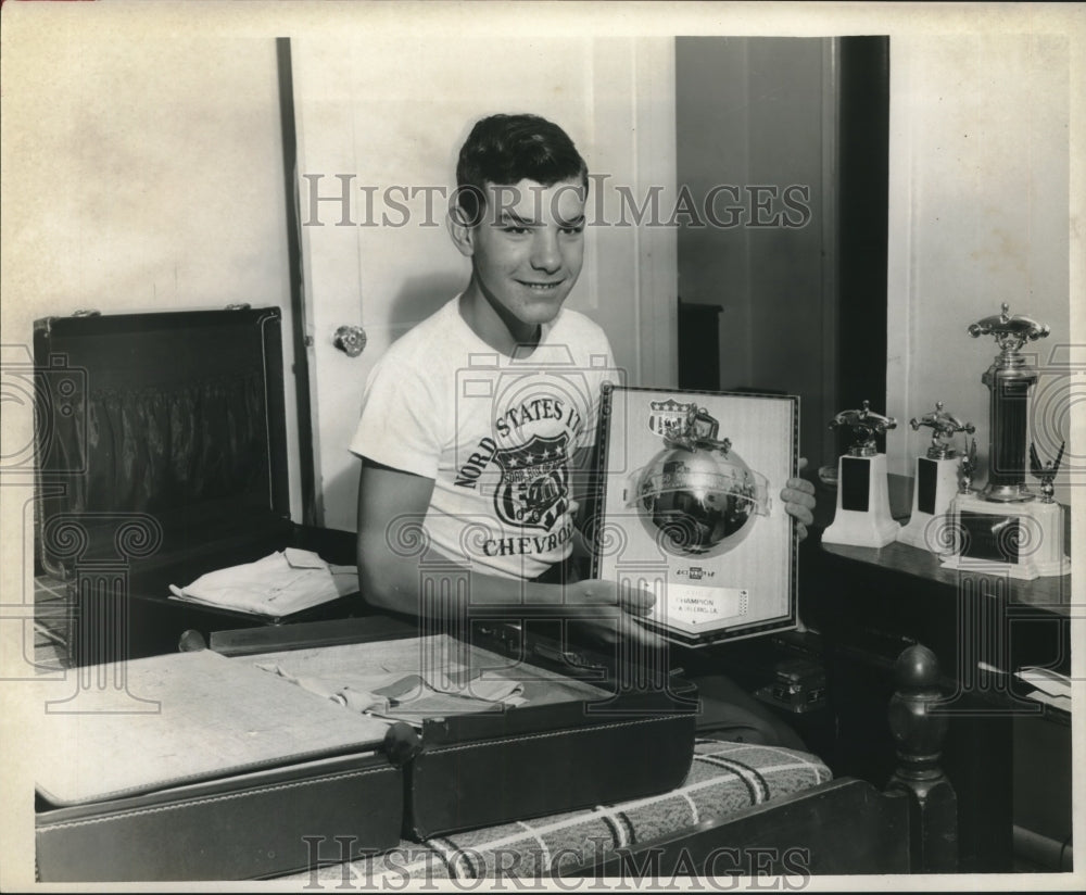 1960 Press Photo Jimmy Folse packing his trophies for school. - nob08274 - Historic Images