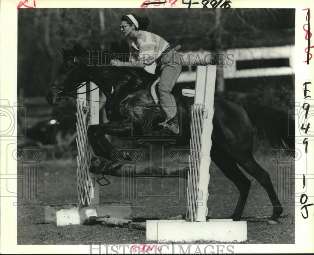 Horse and rider makes a jump at Emeral Fox Farm.-Historic Images