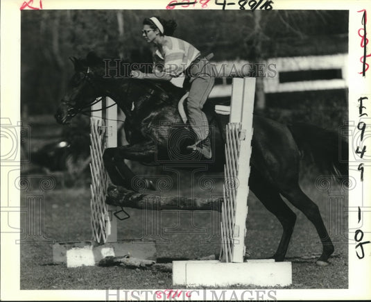 Horse and rider makes a jump at Emeral Fox Farm.-Historic Images