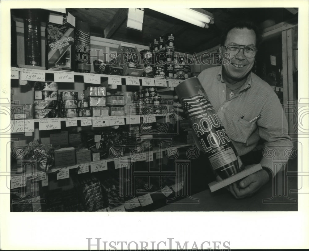 1989 Press Photo Luke LaBruzza shows off his wares at family&#39;s fireworks booth - Historic Images