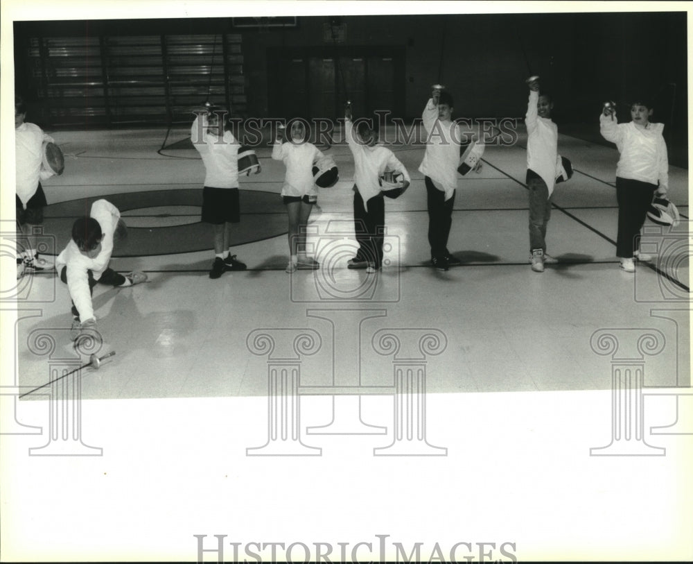 1993 Press Photo St. George Episcapal fencing team student drops his guard. - Historic Images