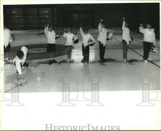 1993 Press Photo St. George Episcapal fencing team student drops his guard. - Historic Images