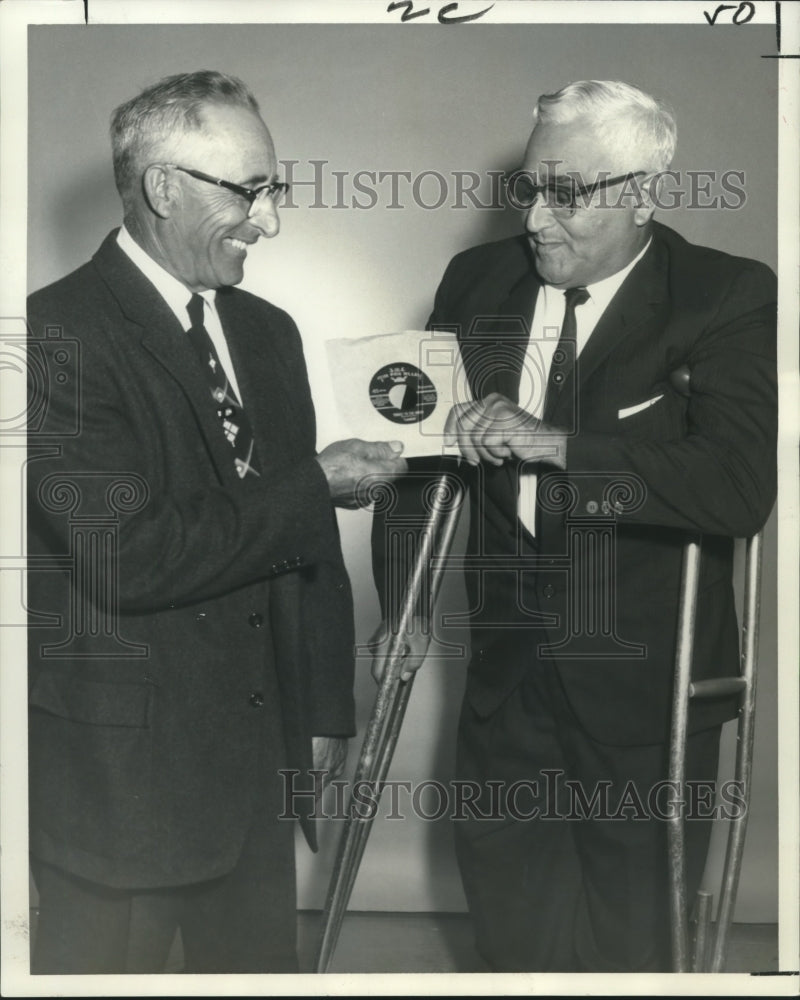 1966 Press Photo Vincent Fiorenzo presents a record to brother Frank Florenzo. - Historic Images