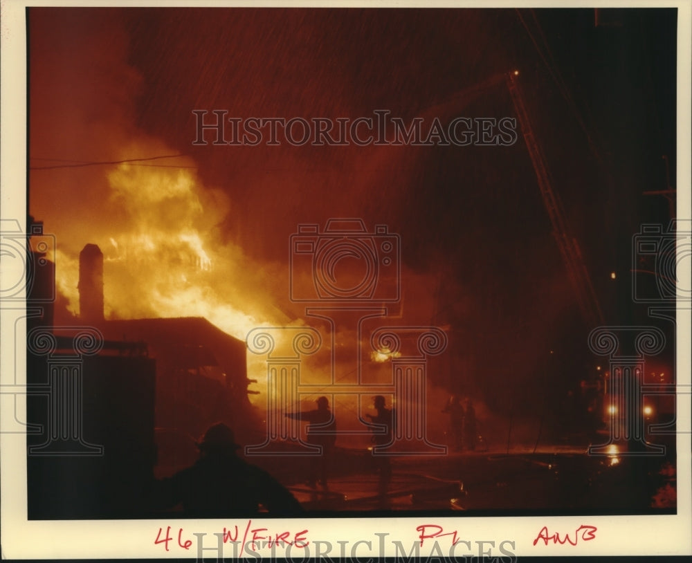 1988 Press Photo Firefighters try to put off the fire - nob10601 - Historic Images