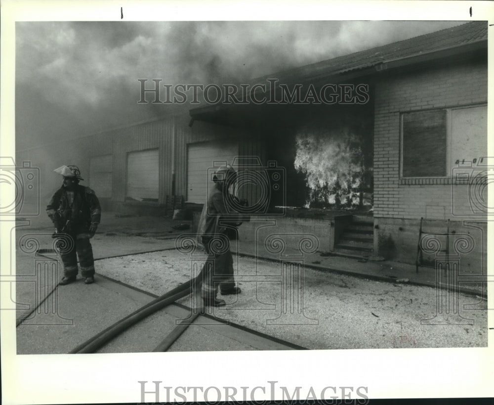 1992 Press Photo Firefighters battling a blazing warehouse fire - nob10738 - Historic Images