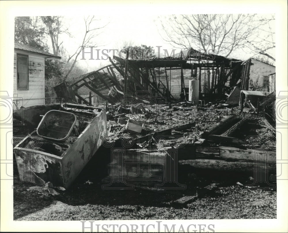 1990 Press Photo Charred remains of the house of Judith White on Reno Street - Historic Images