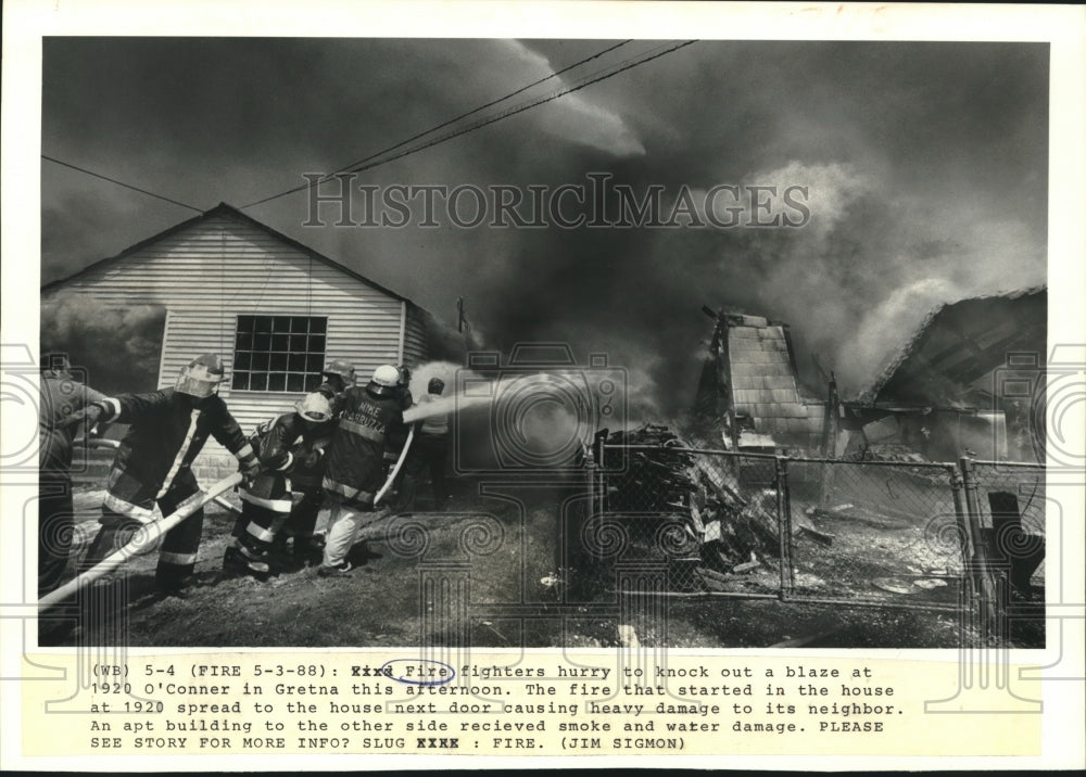 1988 Press Photo Firefighters Battle Blaze That Spread to House Next Door - Historic Images