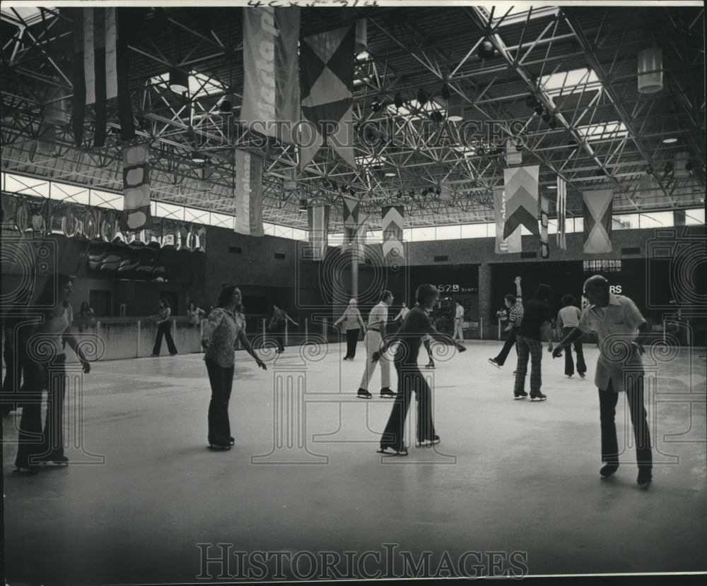 1974 Press Photo Residents skate at the Fiesta Plaza ice rink - nob10999 - Historic Images