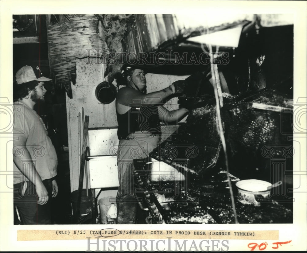 1988 Press Photo Firefighter pulls down debris after kitchen fire - nob11452 - Historic Images