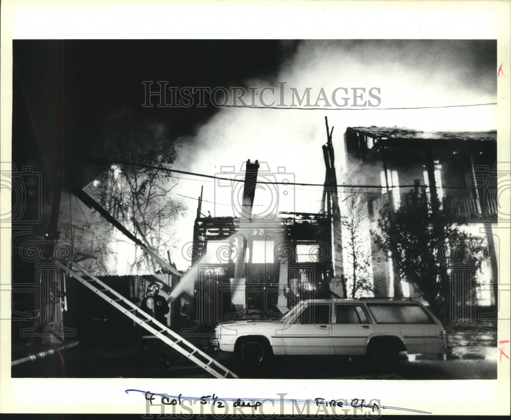 1988 Press Photo Firefighter douses fire with water - nob11488 - Historic Images