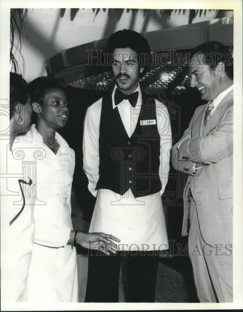 Press Photo Joseph Fredandez talks with others. - nob11947 - Historic Images