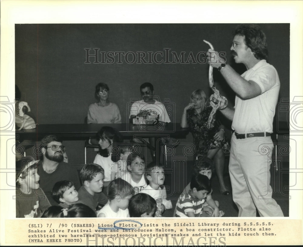 1990 Press Photo Lionel Flotte &amp; Malcom (snake) visit Slidell Library. - Historic Images