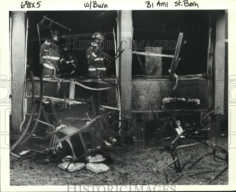 1993 Press Photo Firemen through out burned school equipment at Gauthier School. - Historic Images