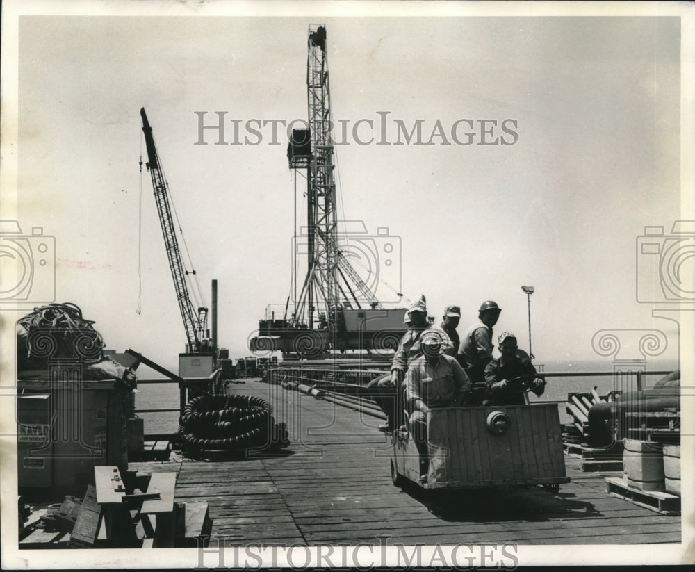 1968 Press Photo Electric carts used to transport men along a bridge - nob12703 - Historic Images