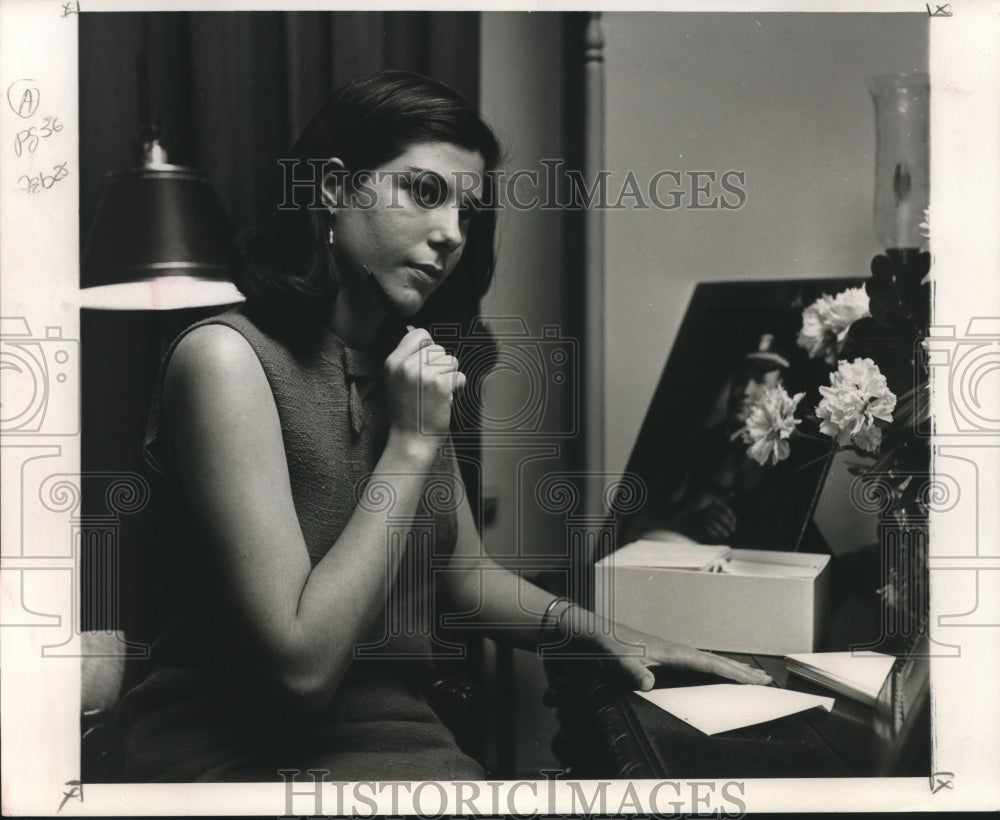 1968 Former deb. Mrs. Frater pauses as writing correspondence. - Historic Images