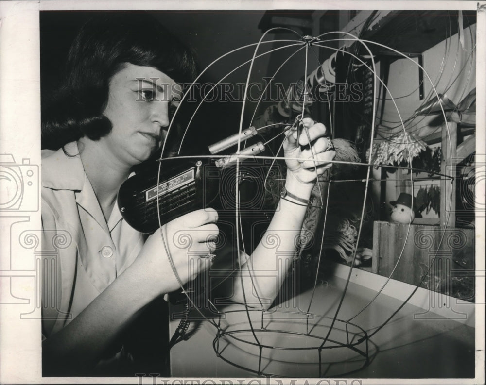 1967 Press Photo Mrs. Fred Foucha works on wire frame for unusual headgear. - Historic Images