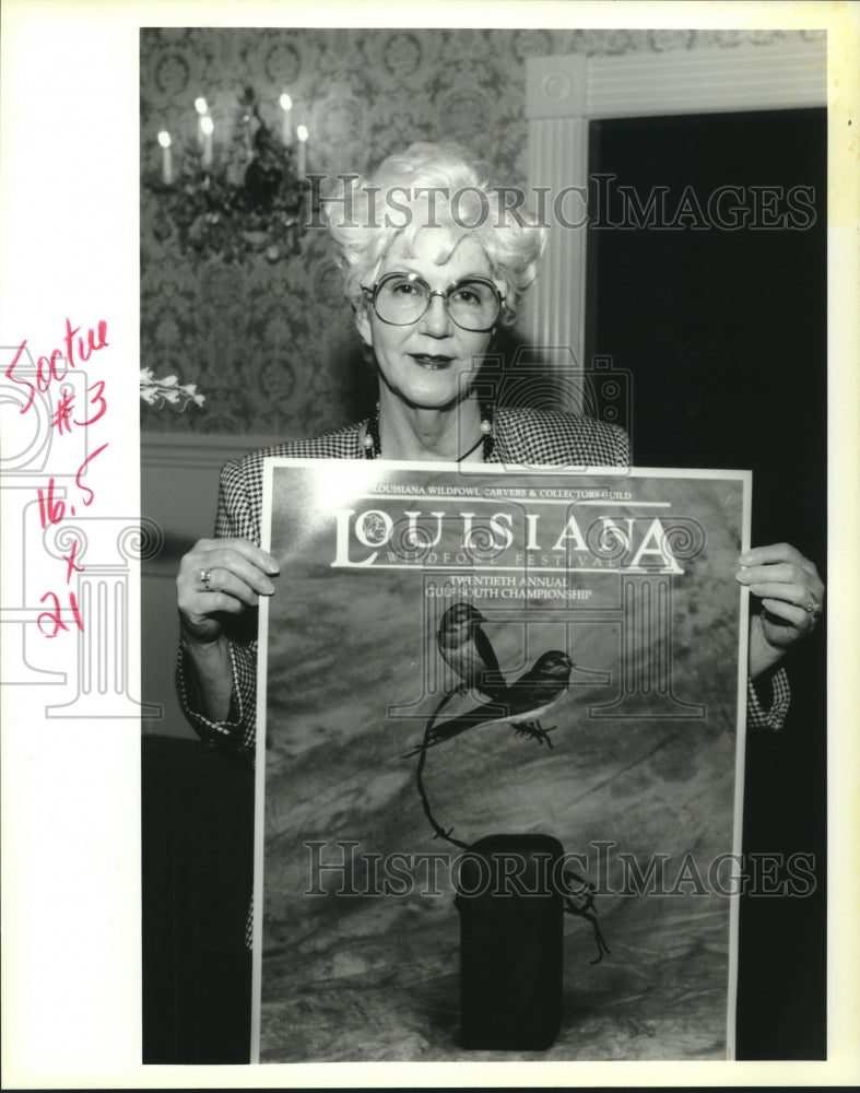 1994 Press Photo Lady Valencia Galatas holds Louisiana Wildfowl Festival poster - Historic Images