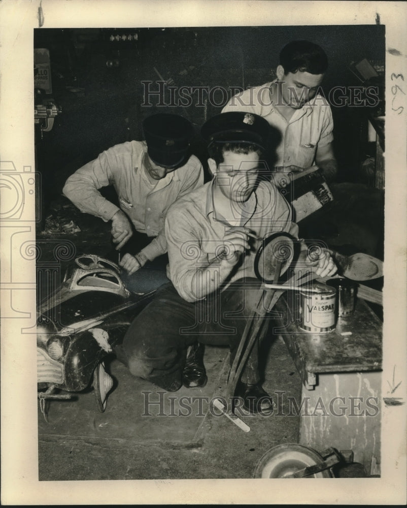 Press Photo Men painting toy parts - nob13372 - Historic Images