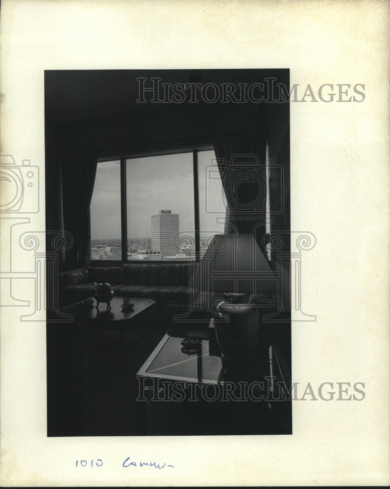 1986 Press Photo Wooden inlaid tables with striped print sofa views buildings - Historic Images