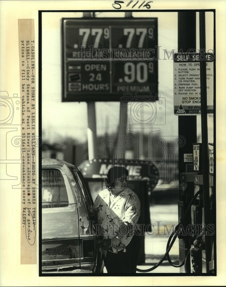 1988 Press Photo Cindy Stevens of Pearl River takes advantage of low gas prices. - Historic Images