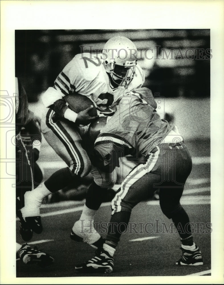 1993 Press Photo Nicholls Running Back Keith Gardner is hit by Carver defender - Historic Images