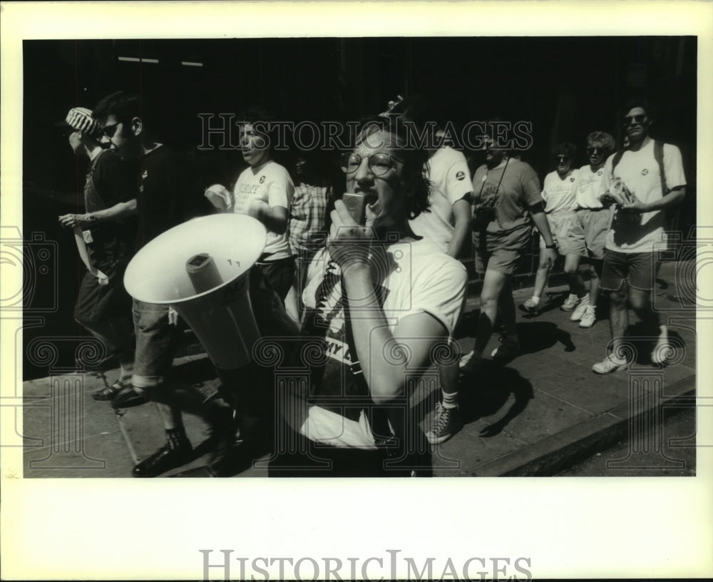 1988 Press Photo Tim Stanford yells through megaphone during Gay parade on Canal - Historic Images