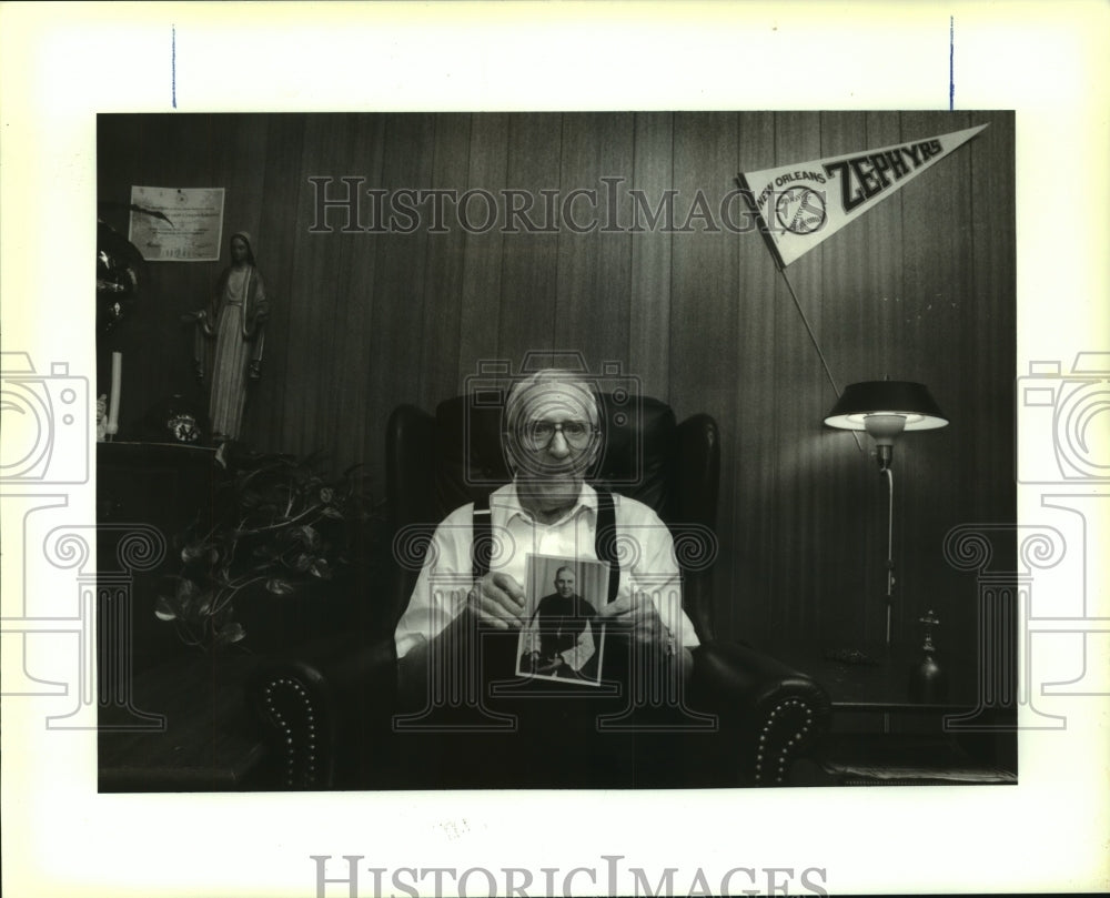 1993 Press Photo Msgr, Paul Gaudin holds photo when he became priest 60 yrs. ago - Historic Images