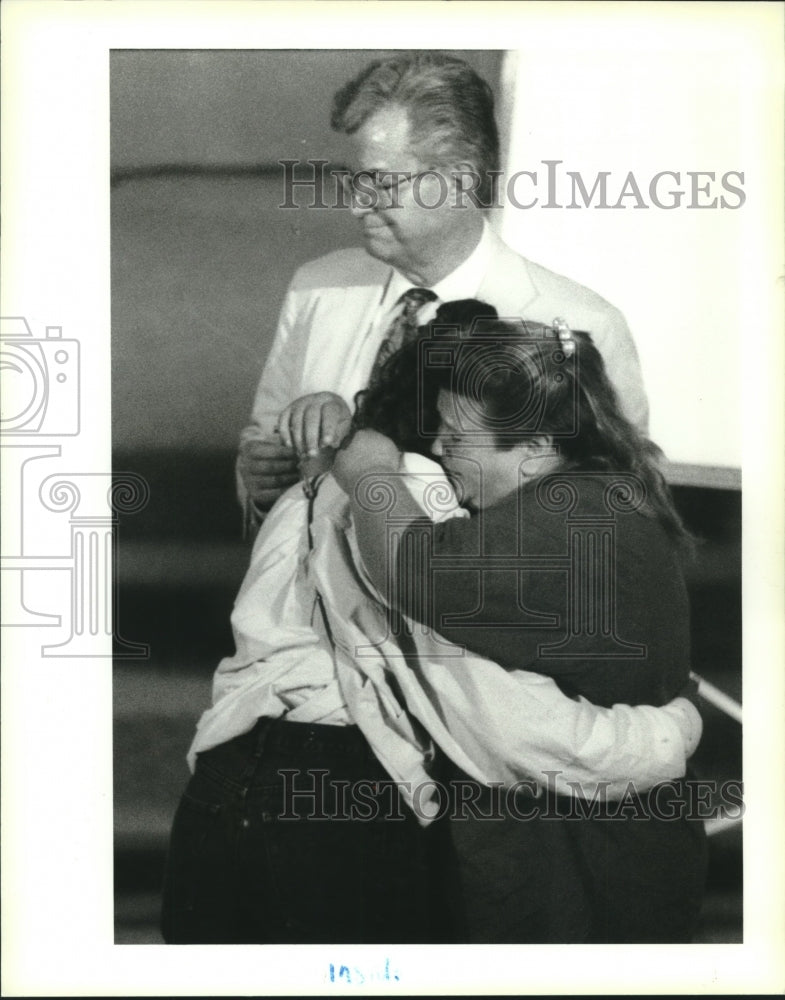 1994 Press Photo Woman hugs her daughter, Marvin Gorman Church - Historic Images