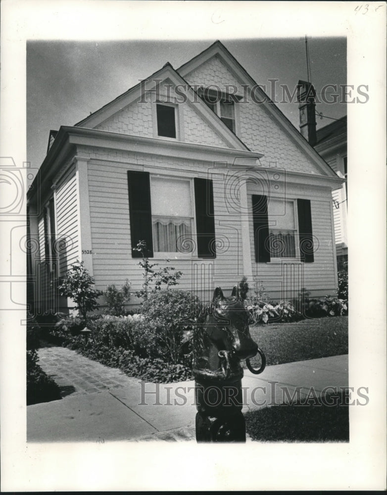 1963 Hitching post stands outside home of the George B. Fleming. - Historic Images