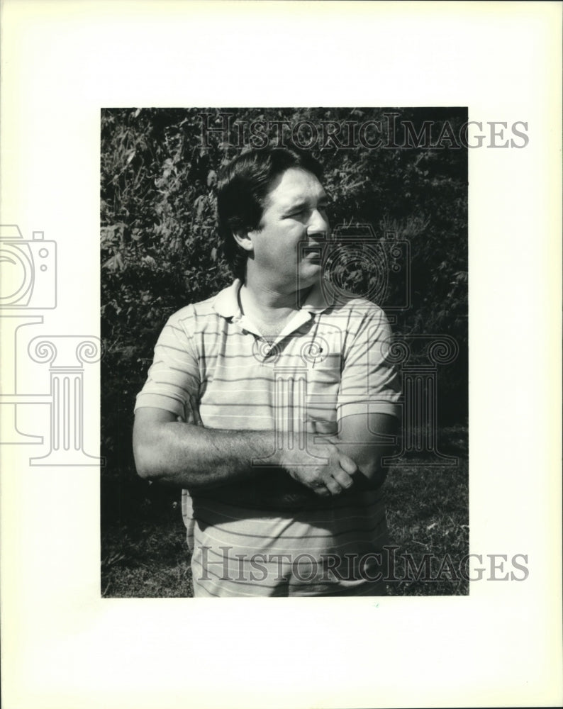 1989 Press Photo Mike Fleming looks toward playground with dumped toxic cans - Historic Images