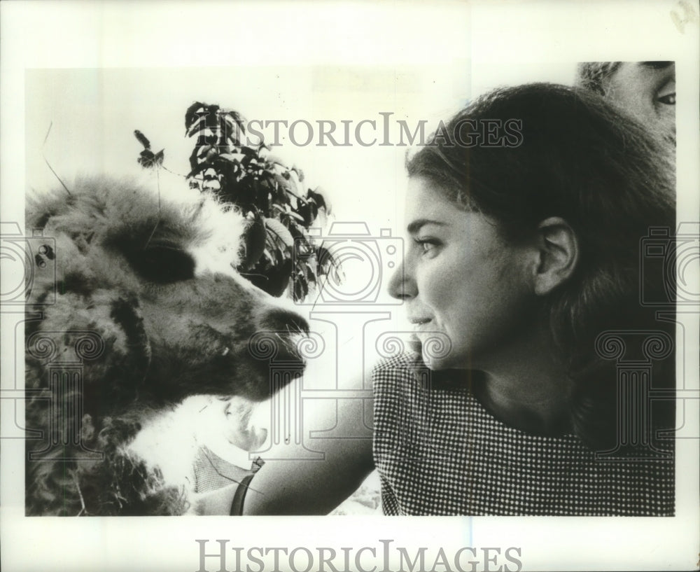 1967 Clem Goldberger, one of Mademoiselle guest editors with a Llama - Historic Images