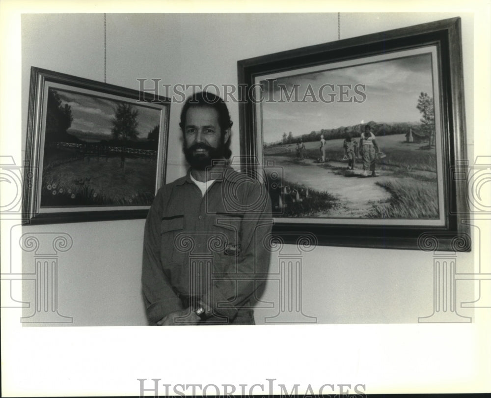 1990 Press Photo Covington artist Phil Grafe and paintings Mandeville City Hall - Historic Images