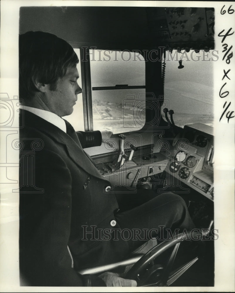 1977 Pilot John Moran monitors Goodyear blimp at Lakefront Airport - Historic Images