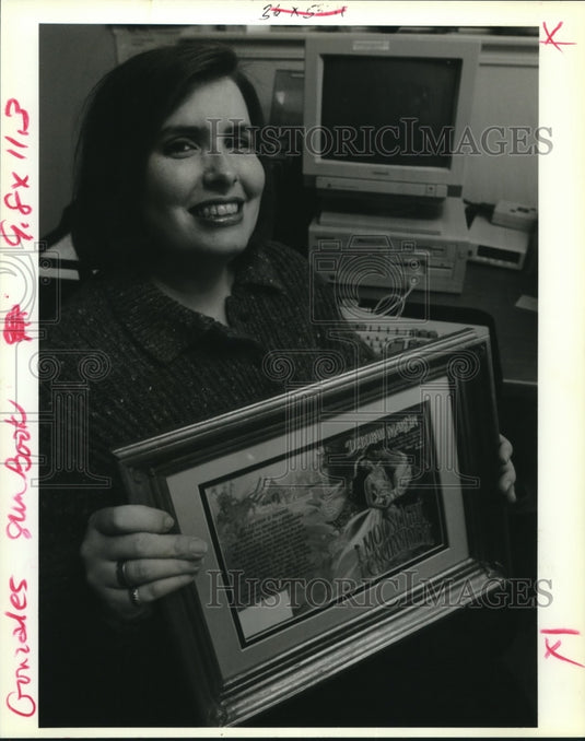 1992 Press Photo Debbie Gonzales holds framed cover of, "Moonlight Enchantment" - Historic Images