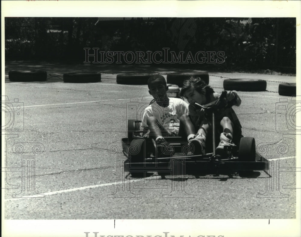 1992 Press Photo Samory White races around with classmates in a go cart - Historic Images