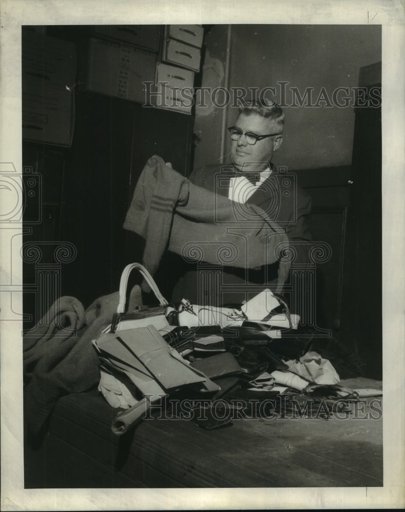 1969 Press Photo Walt Guarino, local theater manager, shows house&#39;s turnover - Historic Images