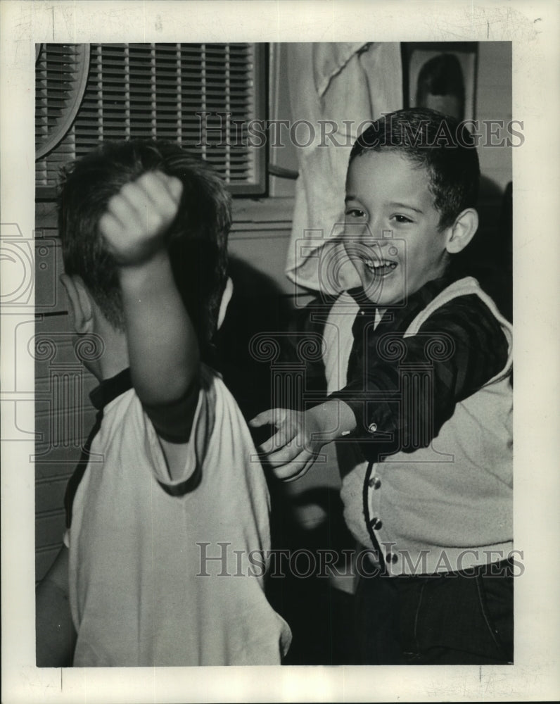 1963 Boys need a place to rough house and play. - Historic Images