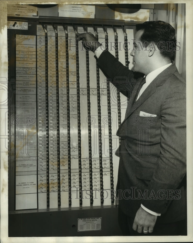 1959 Press Photo Roehl Guidroz checks lengthy ballot - nob21802 - Historic Images