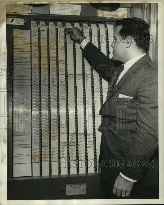 1959 Press Photo Roehl Guidroz checks lengthy ballot - nob21802 - Historic Images