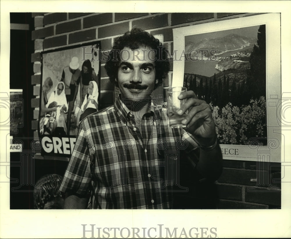 1983 Press Photo Chester Parrish tries a shot of Ouzo at the Greek Festival - Historic Images