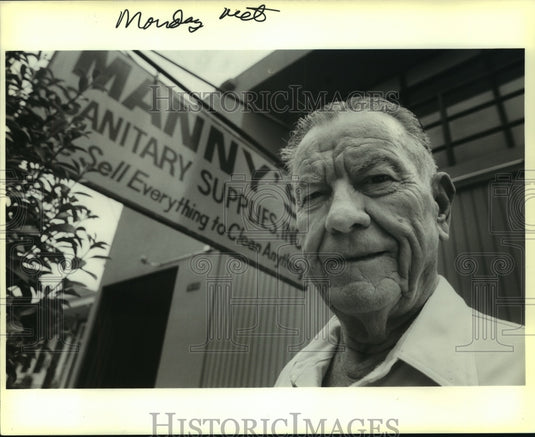1988 Press Photo Manny Guillot in Front of Manny's Sanitary Supplies, Inc. - Historic Images