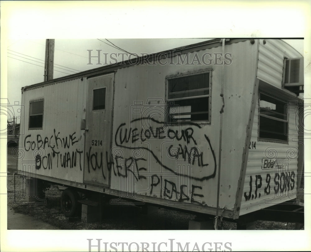 1994 Press Photo Spray paint on the side of a trailer at a work site - nob22893 - Historic Images