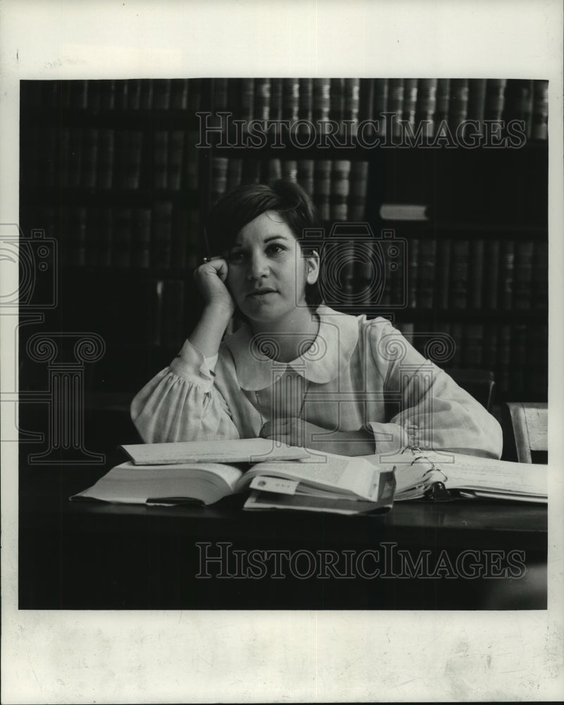 1968 Press Photo Betsy Halstead ponders sitting at her desk - nob23558 - Historic Images