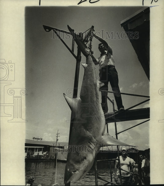 1991 Press Photo Roder Sharp holds up a shark at Grand Isle Tarpon. - nob23645 - Historic Images