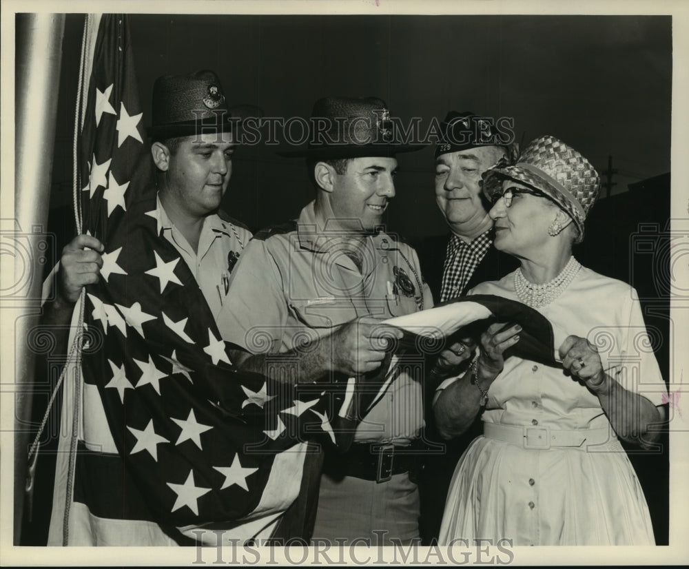 1962 American Legion Post #203 presents flag to Mrs. Van Piegenschue - Historic Images