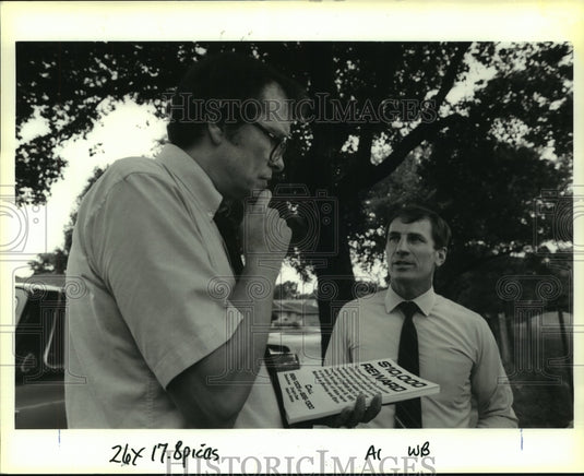 1991 Press Photo Robert Robert Guy handing reward poster regarding son's death - Historic Images