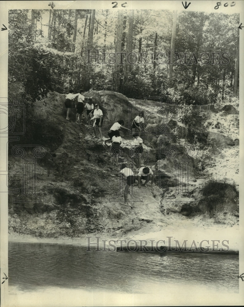 1968 Press Photo Girl Scouts at camp, scale a bank above a stream. - nob24506 - Historic Images