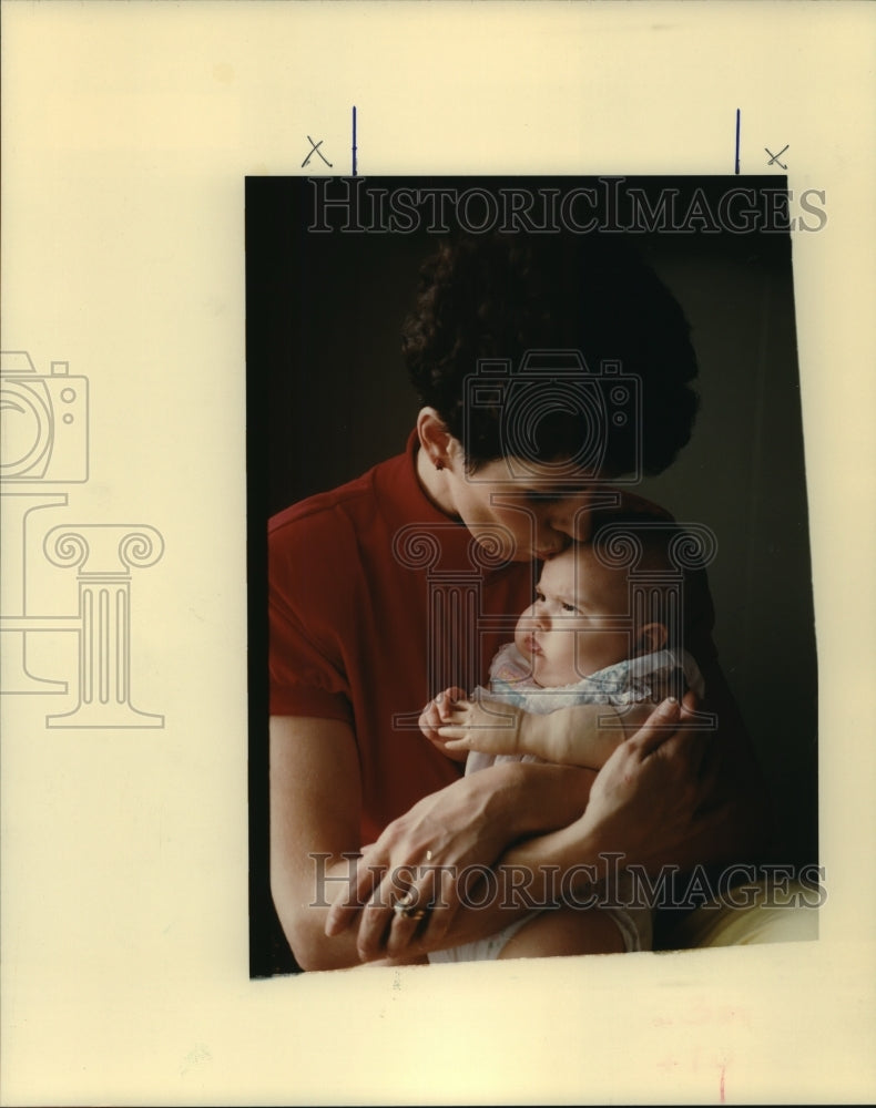 1989 Press Photo Chris Giuffrias cuddles 4-month-old Angelica. - nob24645 - Historic Images