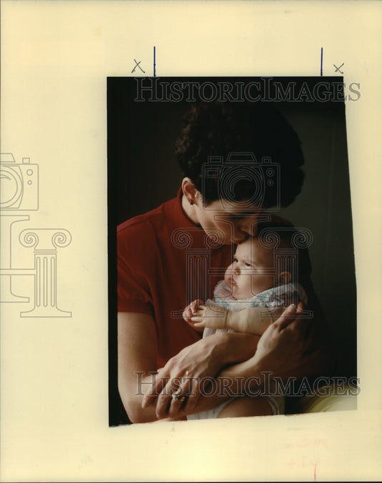 1989 Press Photo Chris Giuffrias cuddles 4-month-old Angelica. - nob24645 - Historic Images